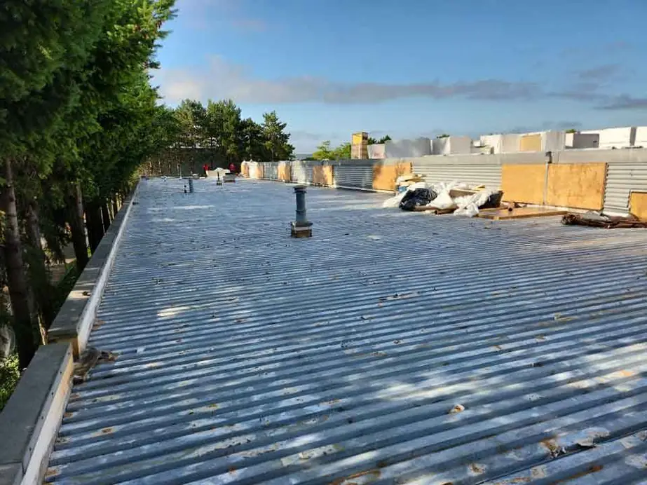Large commercial flat roof with the metal deck prepped and insulation staged for a re-roof